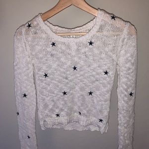 White sweater with navy blue stars